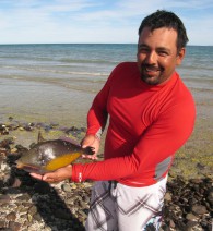 Marcos catches triggerfish by hand